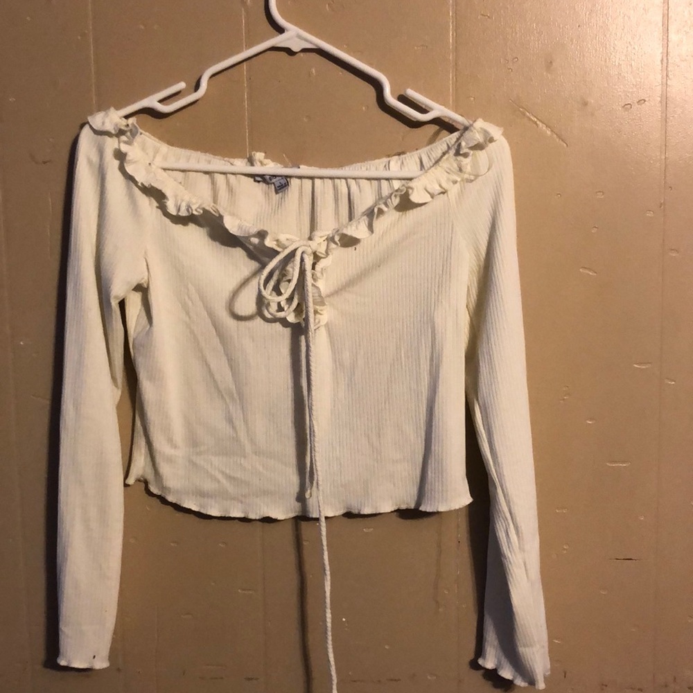 Cream off shoulder ruffled top